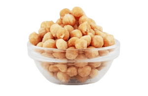 The picture displays a glass bowl full of butterscotch nuts