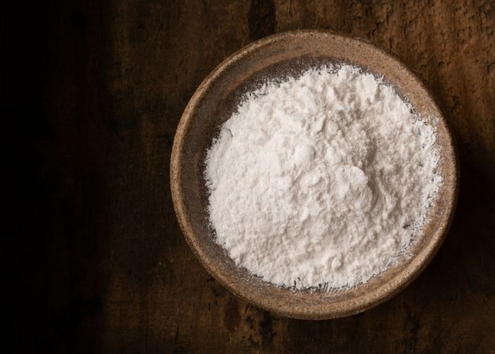 The image features a bowl full of ice cream stabiliser