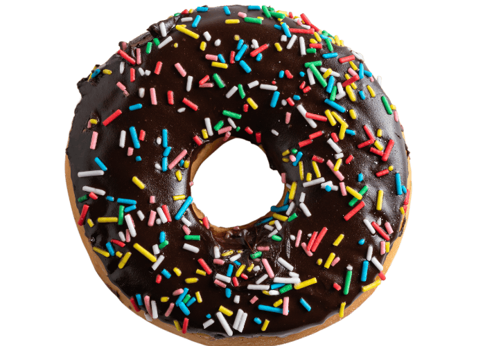 The image features a colorful circular object, likely a doughnut or ciambella, decorated with various colors and a layer of choc dip, enhancing its visual appeal.